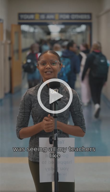 Video still image of Monroe students standing at a microphone